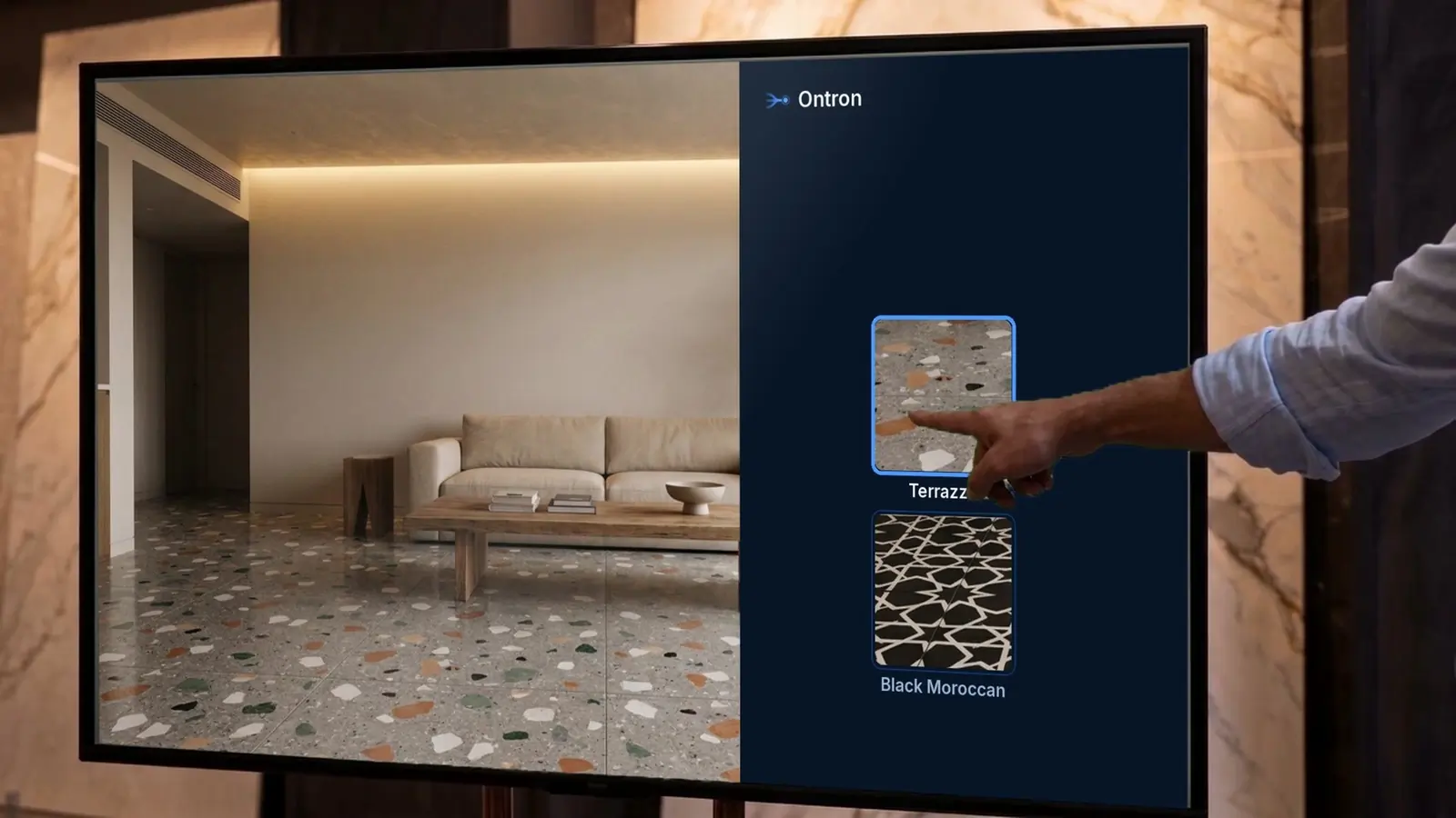 Illustrative photo of a hand choosing Terrazzo on the Ontron TV, beside the room rendered with that floor.